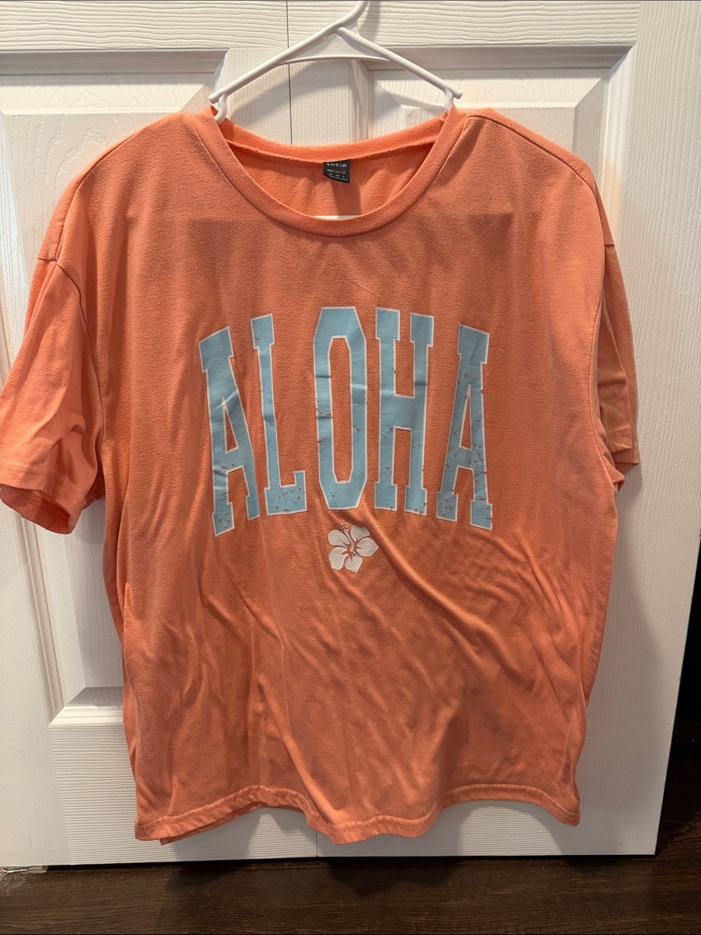 SHEIN Coral Orange ALOHA Graphic Tee with Light Blue Print